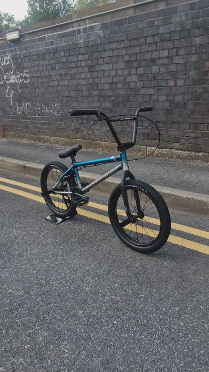 We The People Reason 20.75" TT Bike Matt Trans Teal / Raw Fade