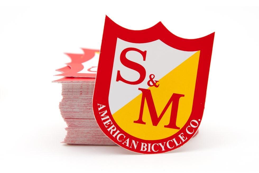 S&M Misc S&M Shield Sticker Red/Yellow Small